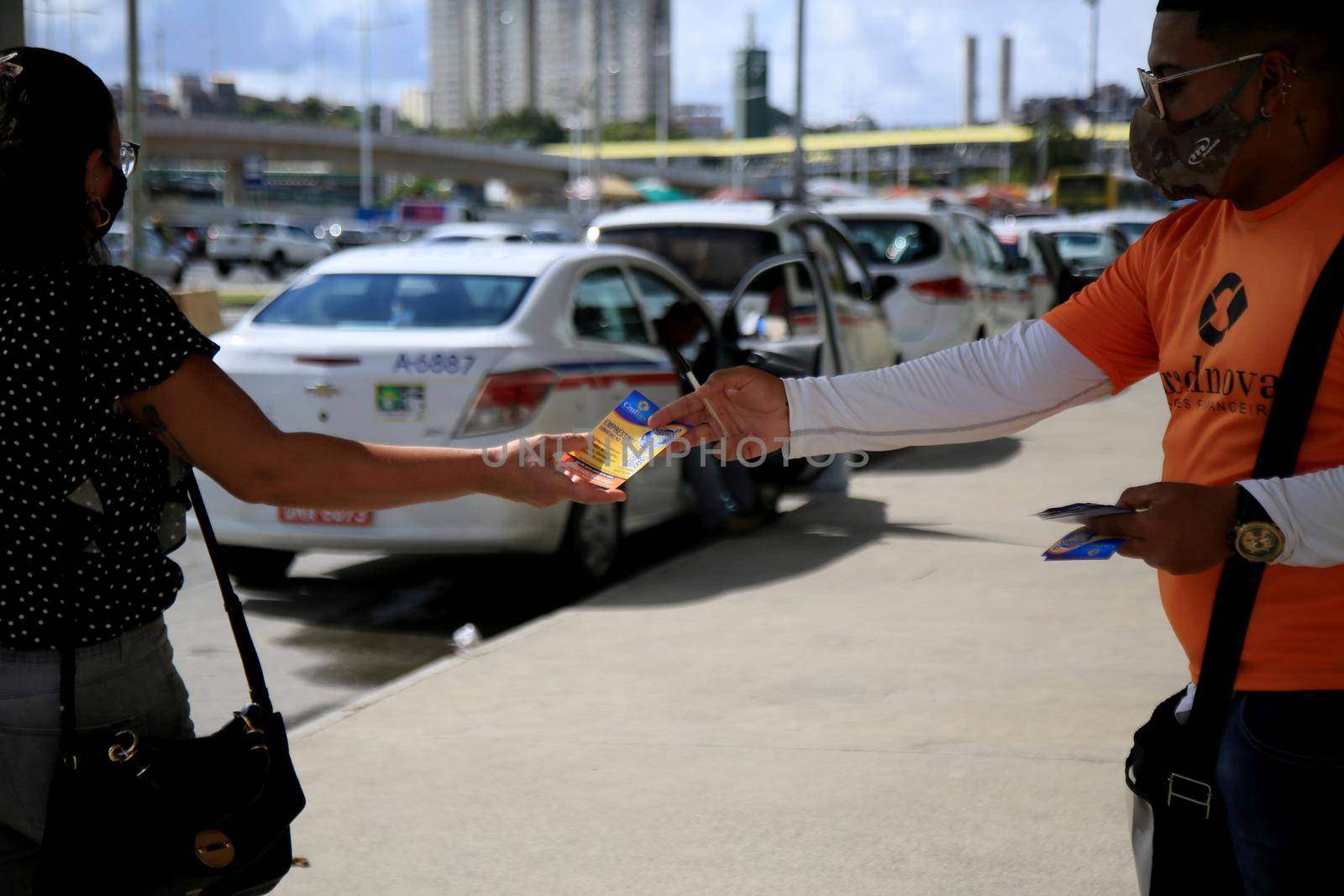 salvador, bahia, brazil - july 20, 2021: person making distribution of service disclosure pamphlet on the street in the city of Salvador.