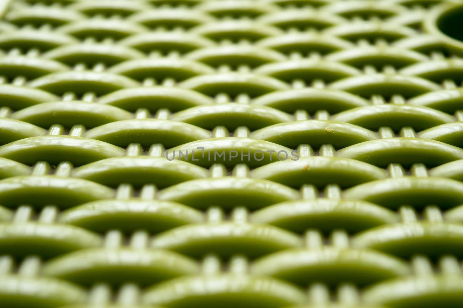 Chinese seamless pattern on green color plastic screen. Close up. Abstracts and backgrounds. Repeat vector knitted Design and pattern element Selective Focus. by sudiptabhowmick