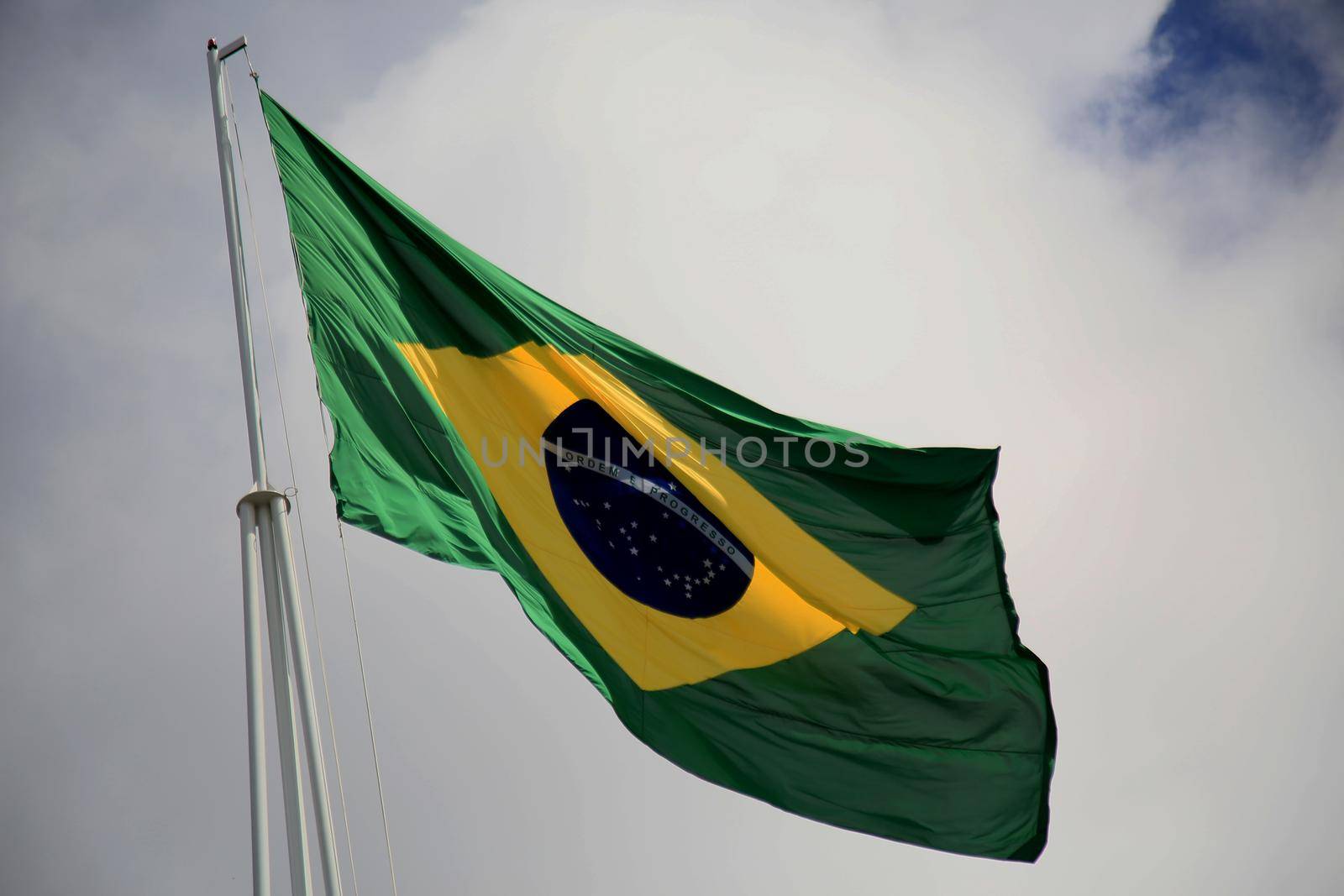 salvador, bahia, brazil - july 20, 2021: Flag of Brazil is seen on the pole of a supermarket in the city of Salvador.