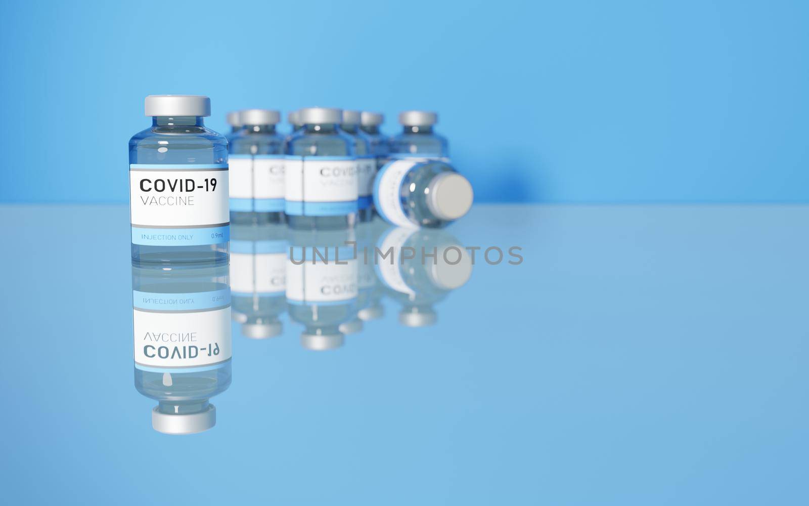 MANY CORONAVIRUS VACCINES ON A GLASS TABLE WITH BLUE BACKGROUND