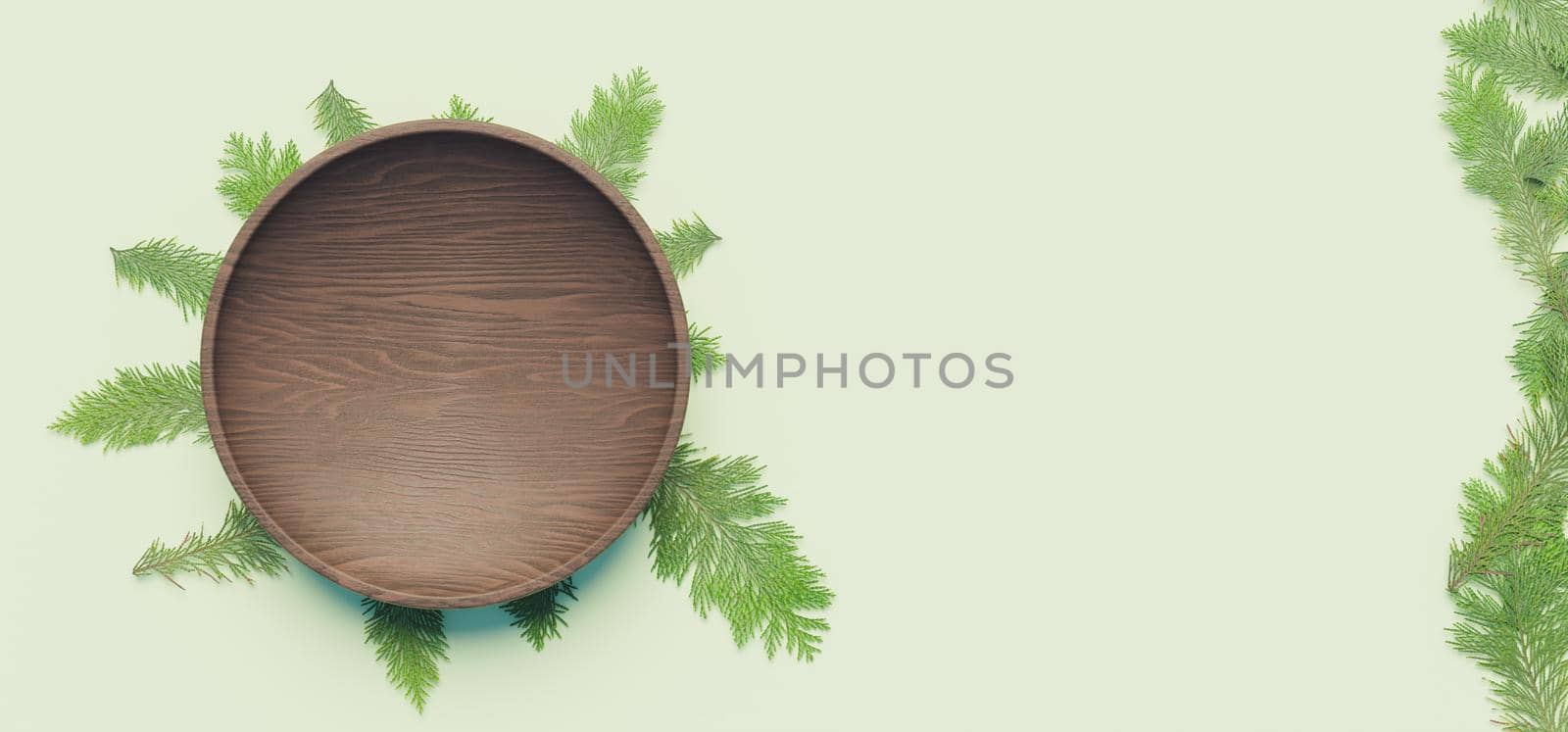 dark wooden plate with pine leaves underneath and on the side of the image on pastel green background. 3d illustration