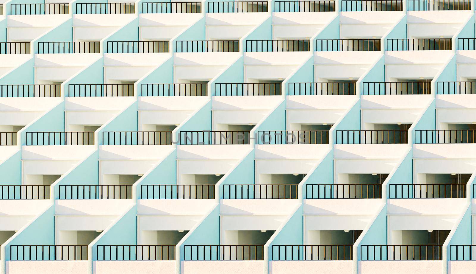 facade of apartments with their terraces by asolano