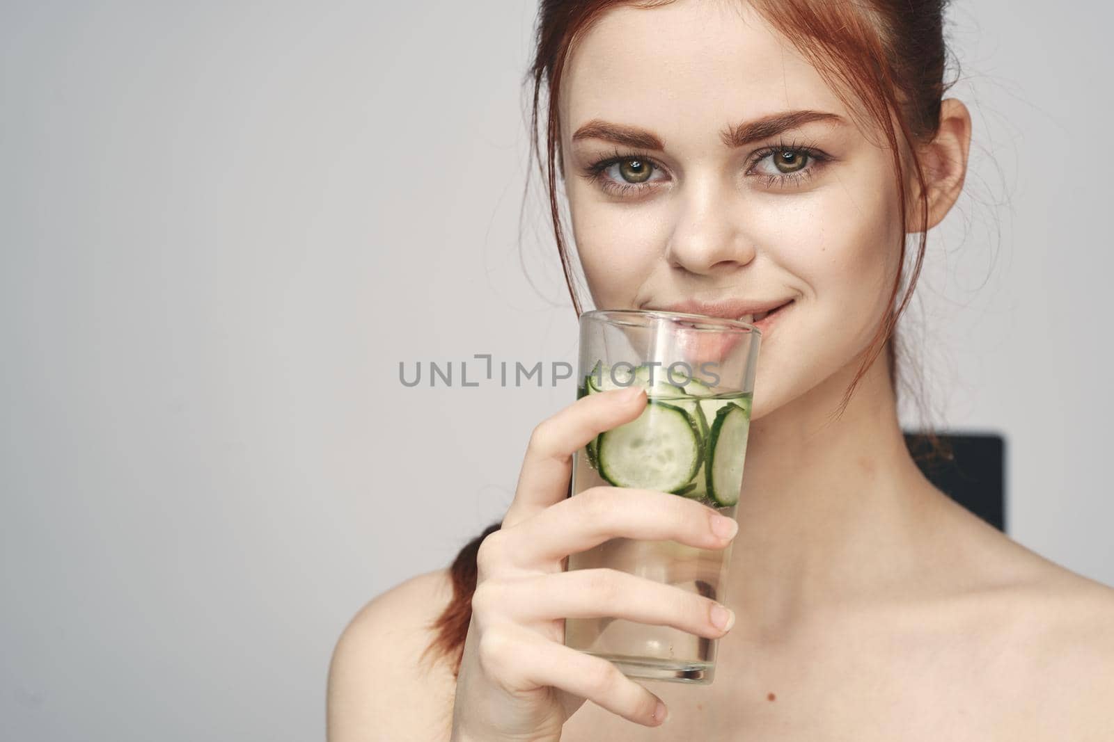 woman with bare shoulders cucumber health drink Fresh by Vichizh