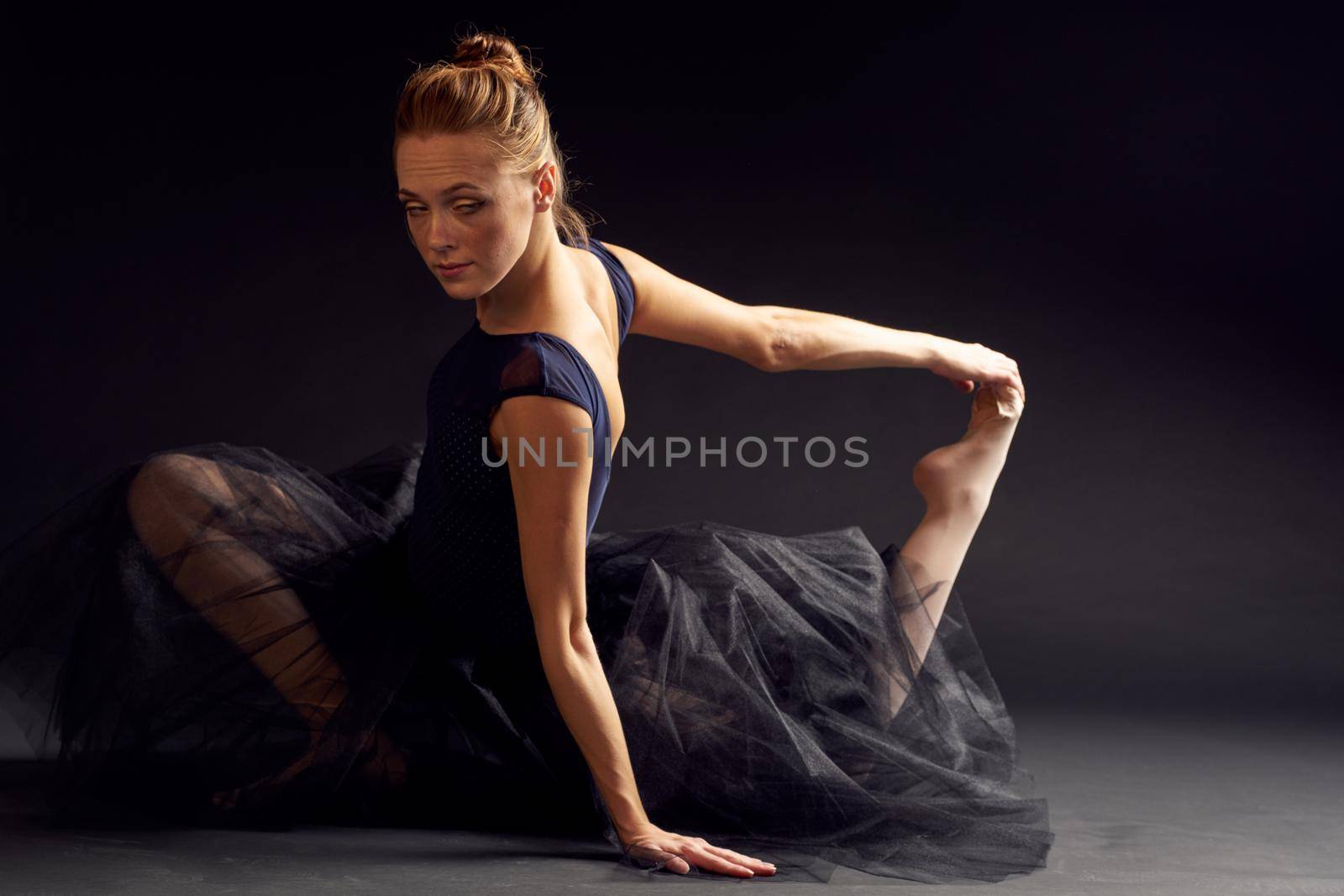 women ballerina in a black dress dance fashion exercise studio lifestyle. High quality photo