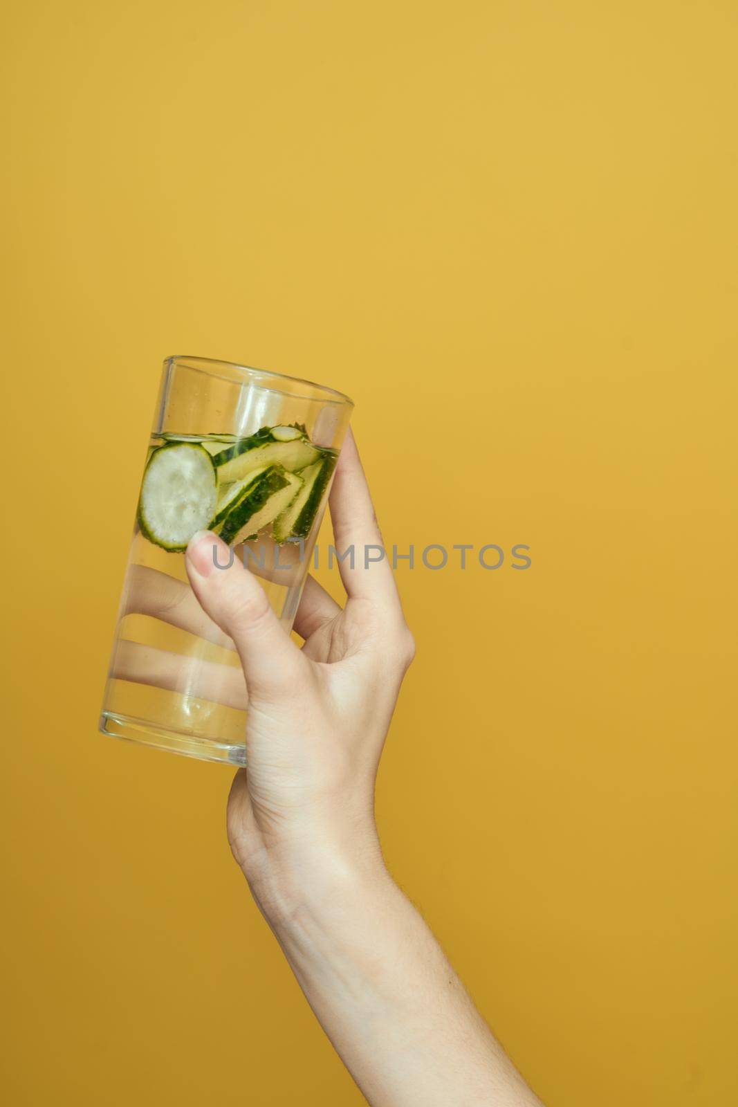 cucumber Fresh vitamins detoxification yellow background cosmetology by Vichizh