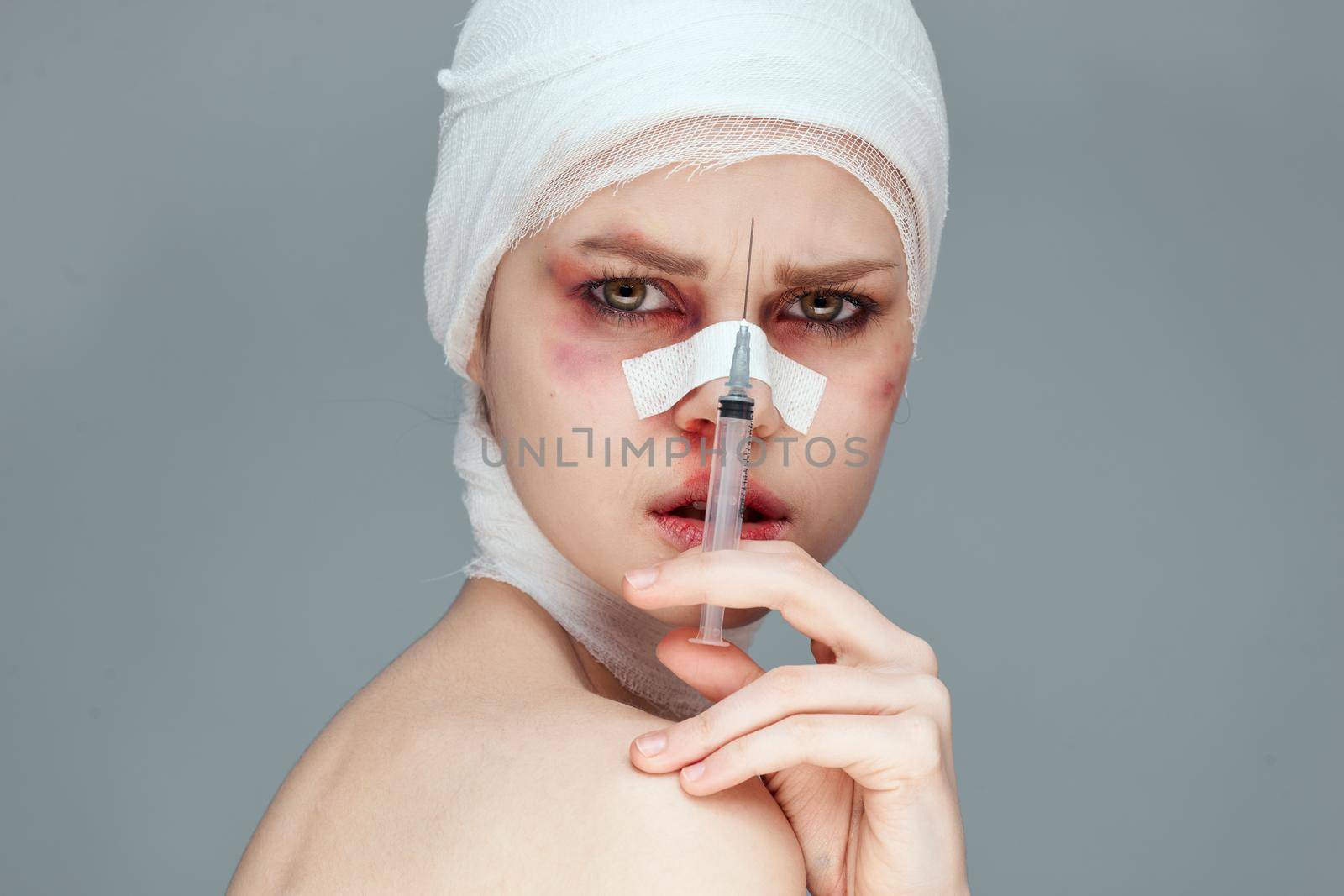 female patient plastic surgery operation bare shoulders isolated background. High quality photo