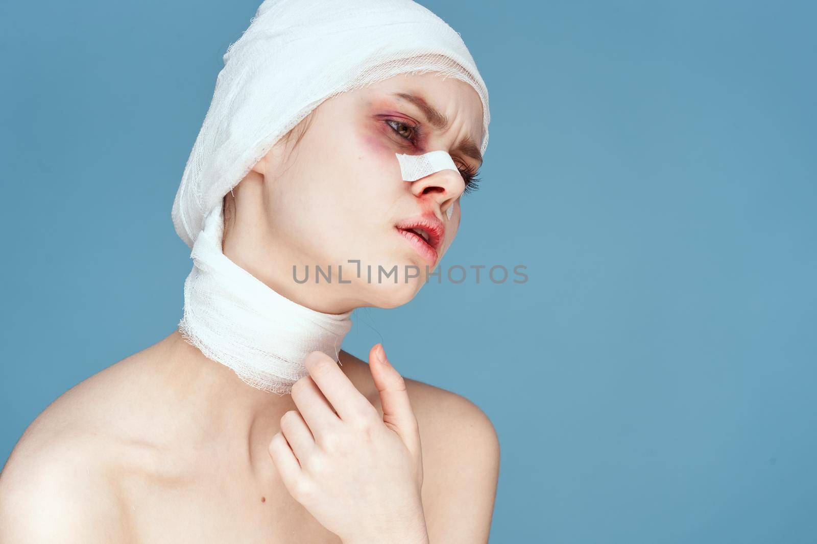 female patient posing in blue gloves red lips surgery facial rejuvenation studio lifestyle by Vichizh
