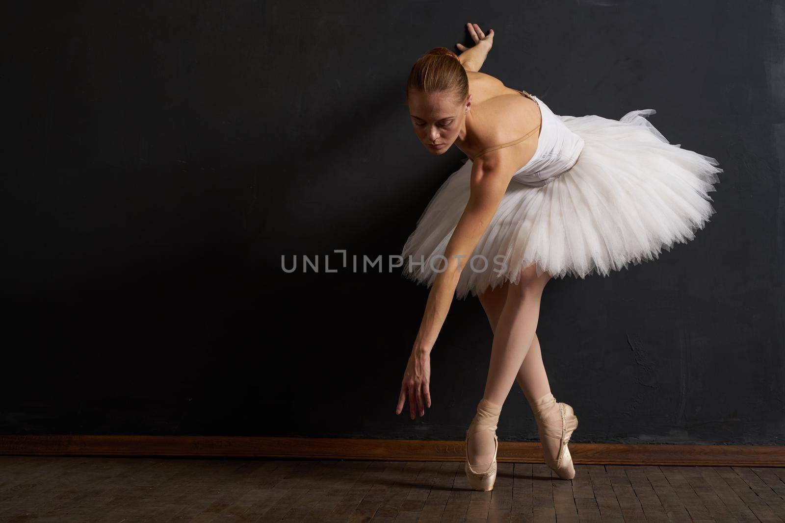 ballerina dance performance classic dark background tradition. High quality photo