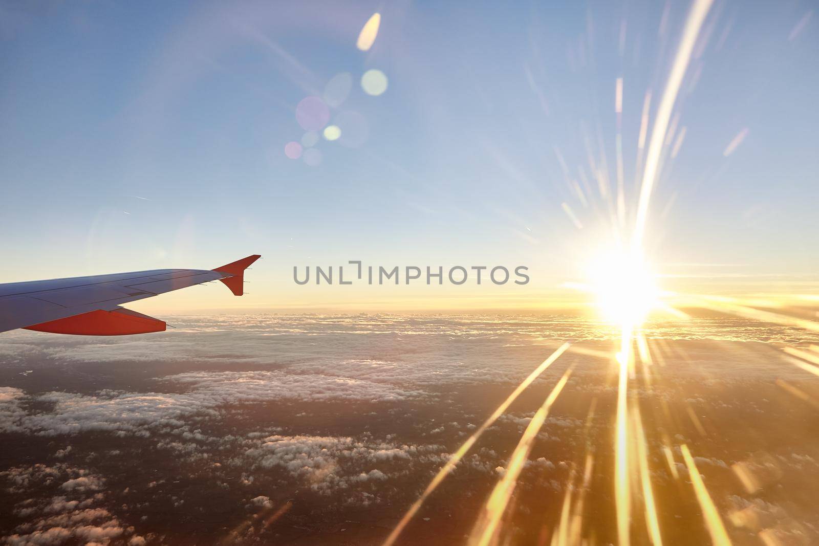 operation departure and landing from the atlantic airport of Nantes with rays light at sunset