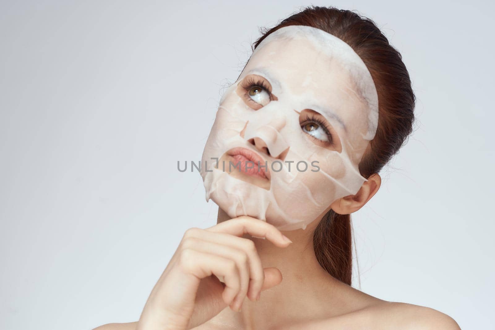 pretty woman naked shoulders face mask close-up skin care by Vichizh