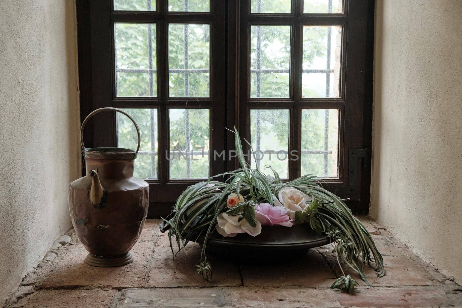 composition of copper container and plants with old window