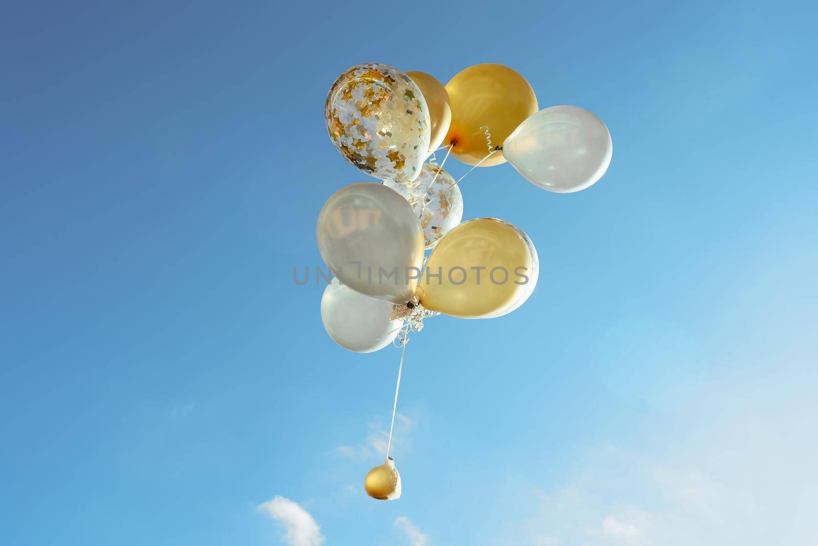 yellow white transparent balloons blue sky 