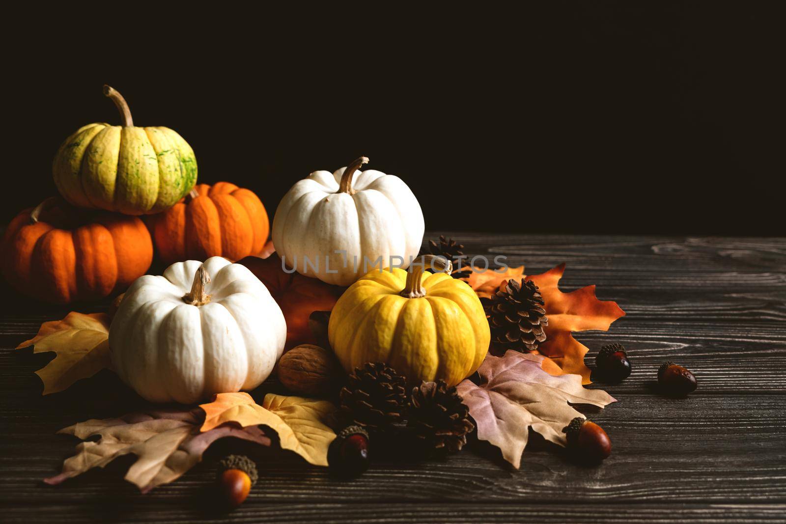 Happy Thanksgiving Day with pumpkin and nut on wooden table by psodaz