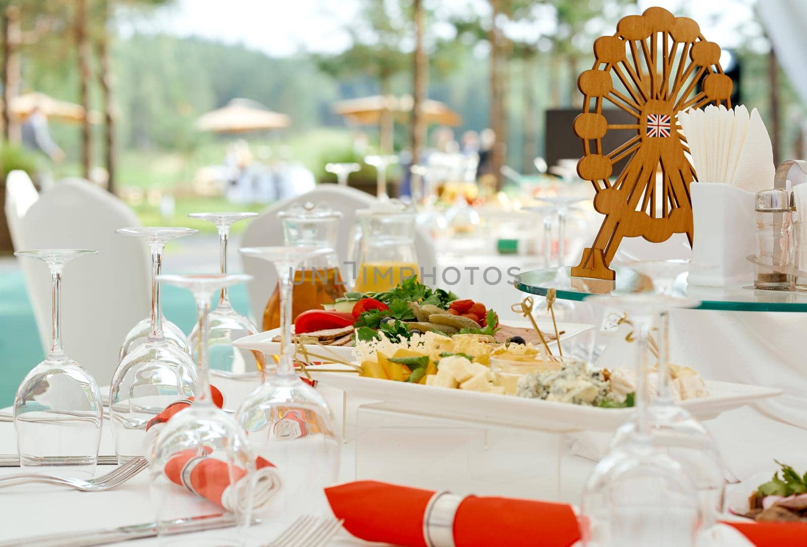 Catering. A serving table, ready for the arrival of guests. Stylized as England. With red napkins and the London Eye. High quality photo