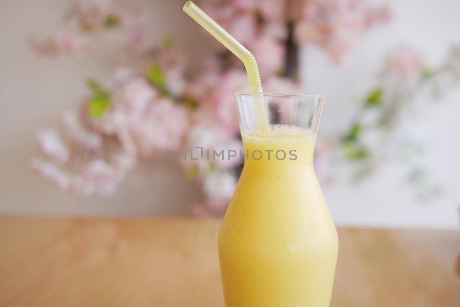 pineapple juice in a bottle on table .