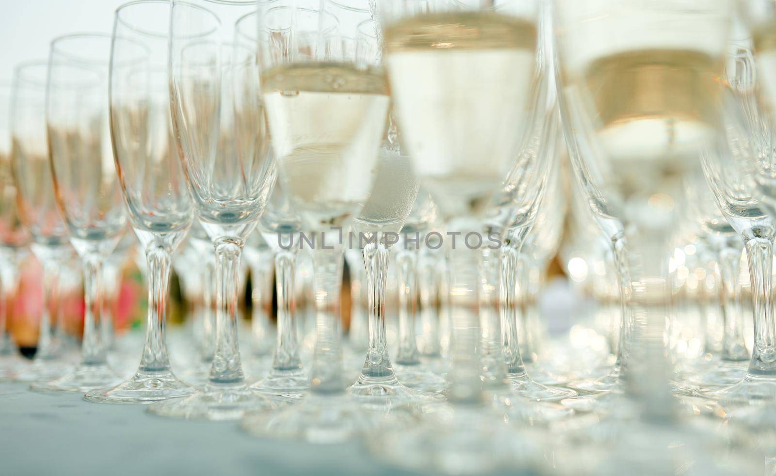 A row of wine glasses on a table. High quality photo