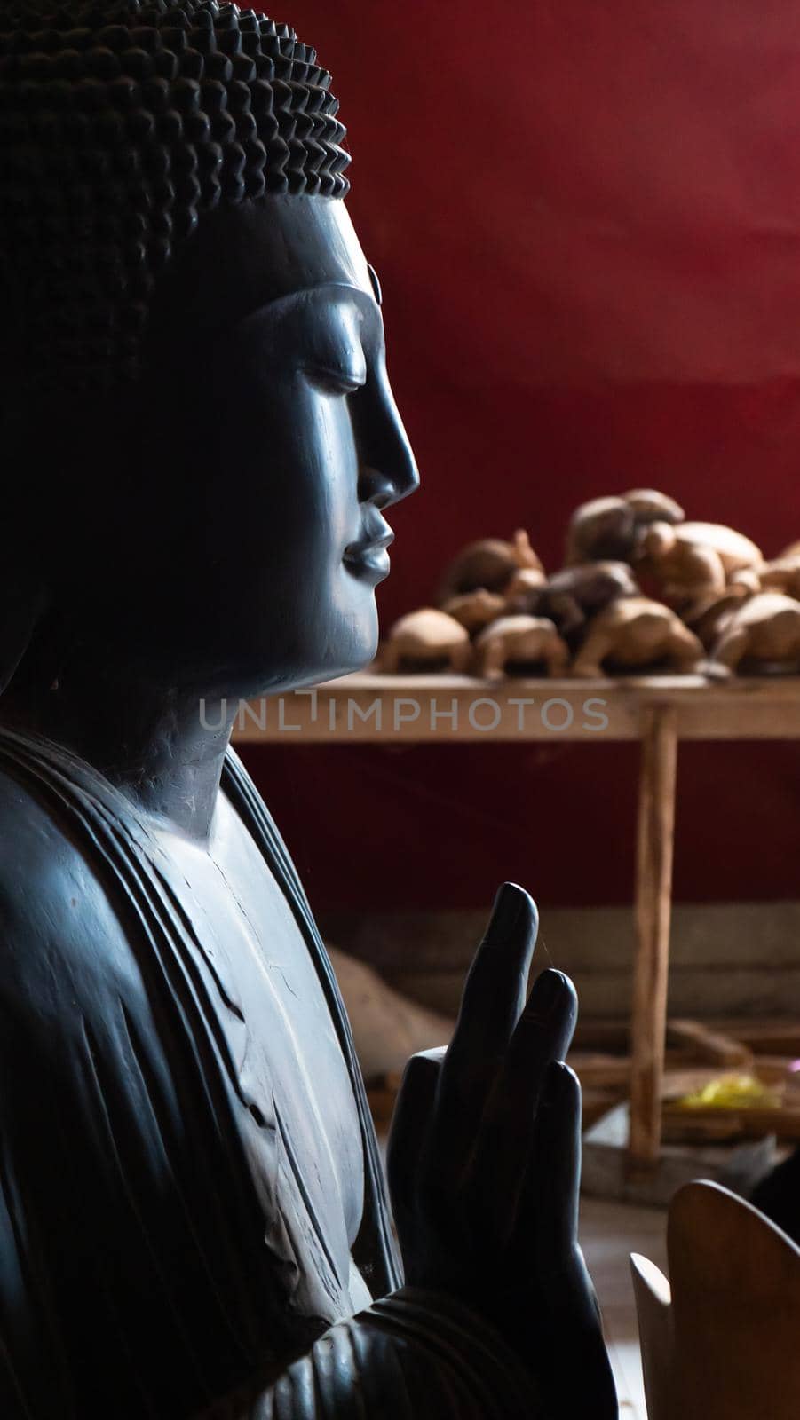 Hindu and Buddhist wooden carving. souvenir shop selling souvenirs and handicrafts of Bali at famous Ubud Market, Indonesia