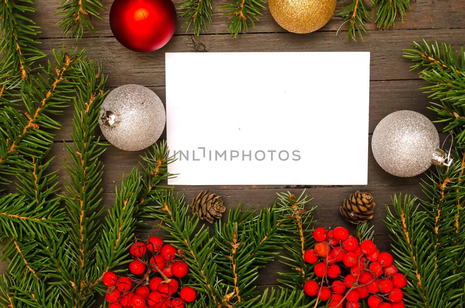 Christmas card with new year decor on wooden background.