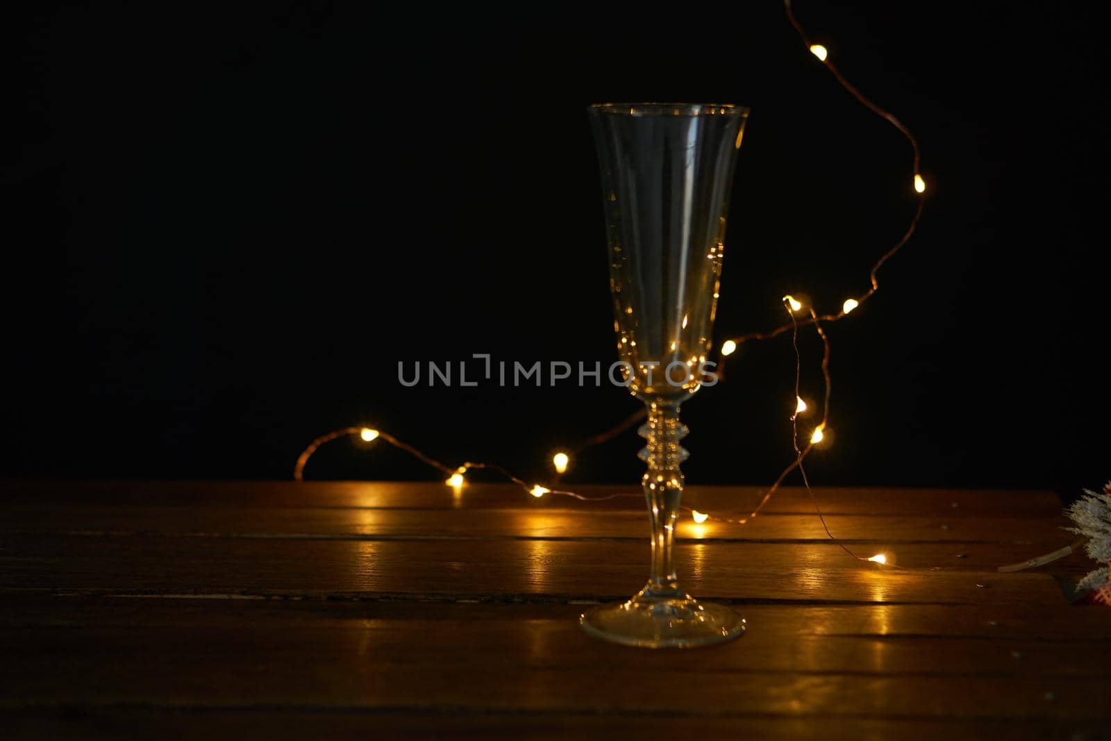 christmas decoration champagne glasses garland holiday wooden table. High quality photo