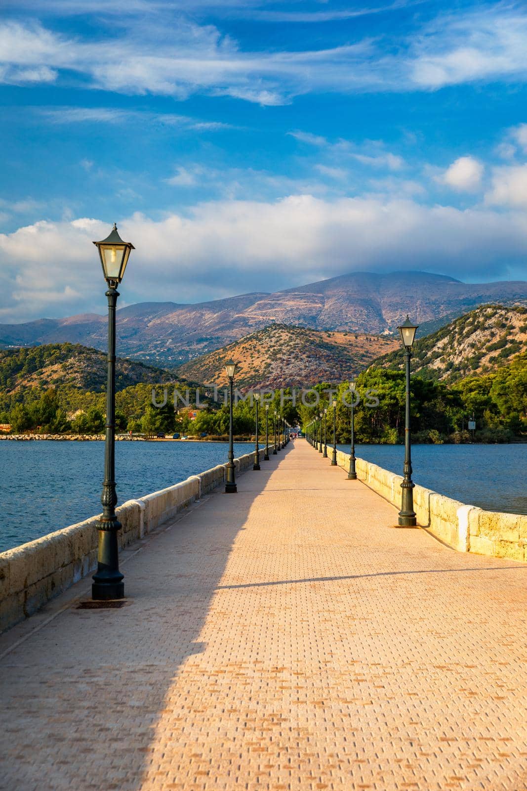 View of the De Bosset Bridge in Argostoli city on Kefalonia island. De Bosset Bridge on lakeside In Argostoli, Kefalonia. Obelisk and the de Bosset bridge in Argostoli, Kefalonia, Greece