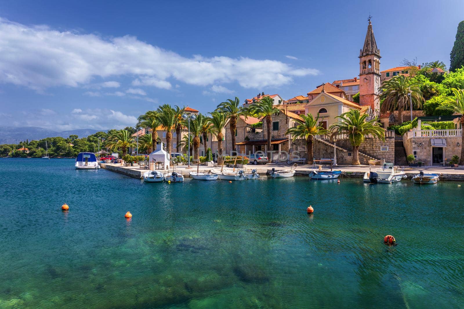 Fishing boats in Splitska village with beautiful port, Brac island, Croatia. Village of Splitska on Brac island seafront view, Dalmatia, Croatia, Croatia.