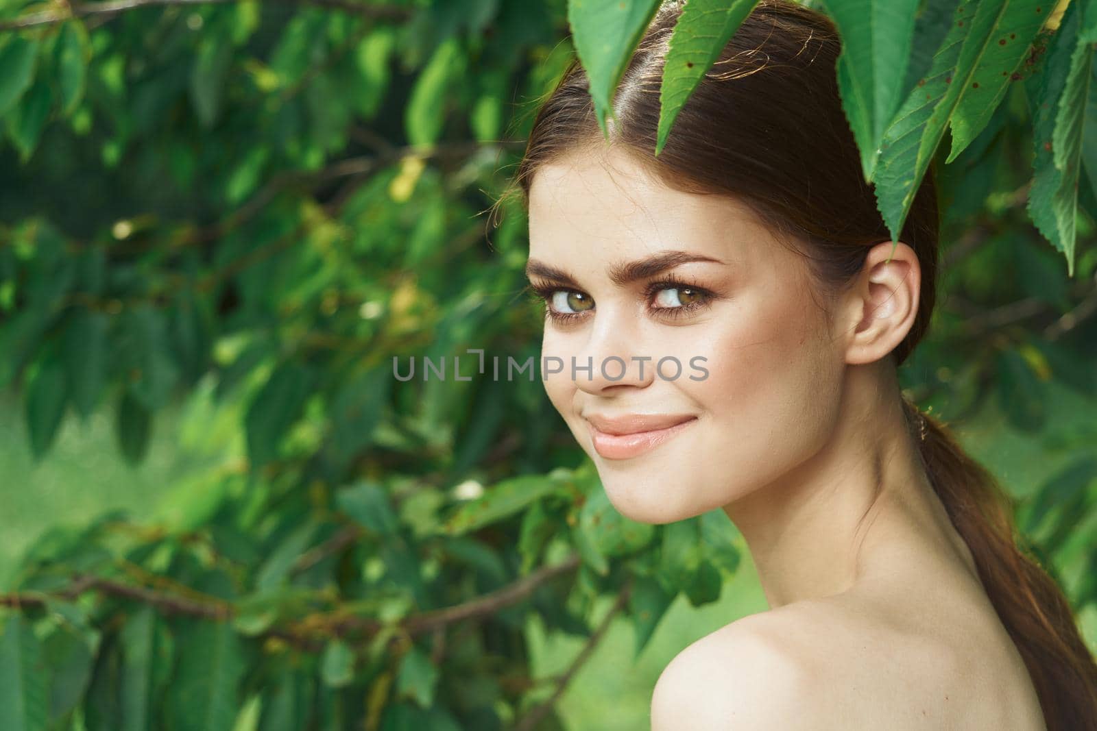 pretty woman Cosmetology nature green leaves glamor cropped view by Vichizh