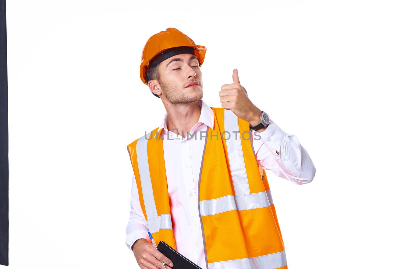 man in orange hard hat engineer work professionals construction. High quality photo