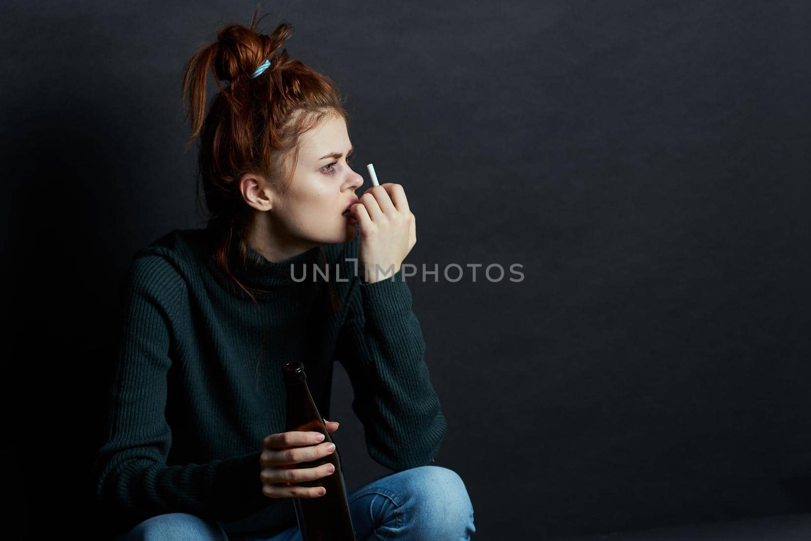 woman with fingal capital smokes a cigarette depression abuse. High quality photo