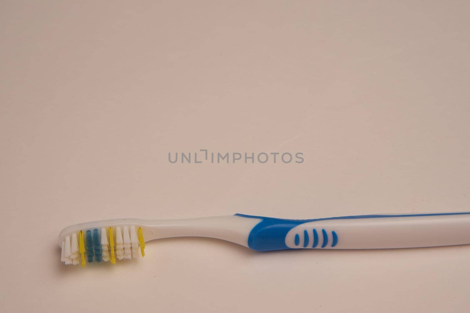 bathroom items hygiene care toothbrush light background by Vichizh