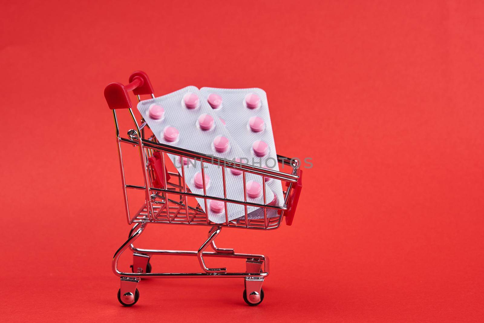 small trolley with medicines pharmacy shop pills shopping by Vichizh