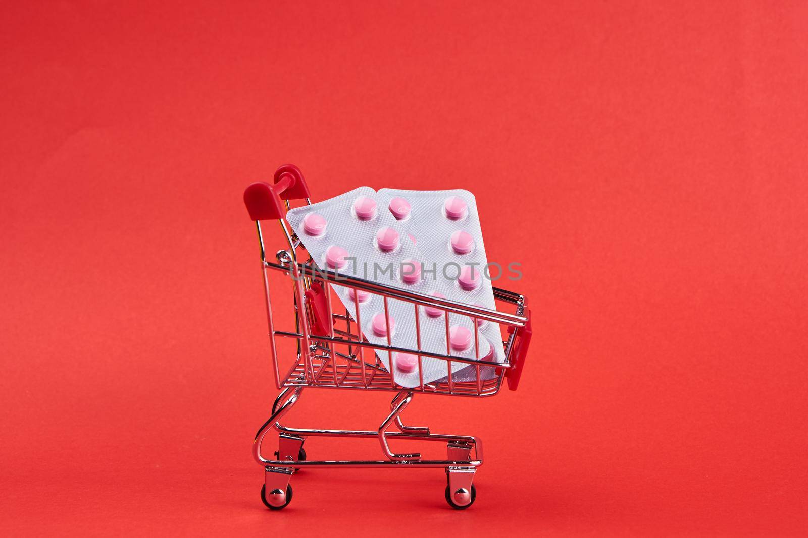 small trolley with medicines pharmacy shop pills shopping by Vichizh