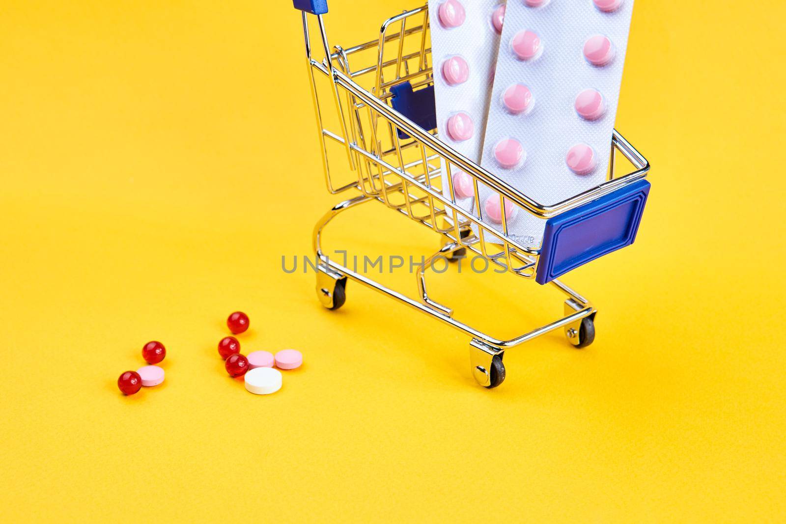 drug trolleys service delivery shopping pharmacy yellow background. High quality photo