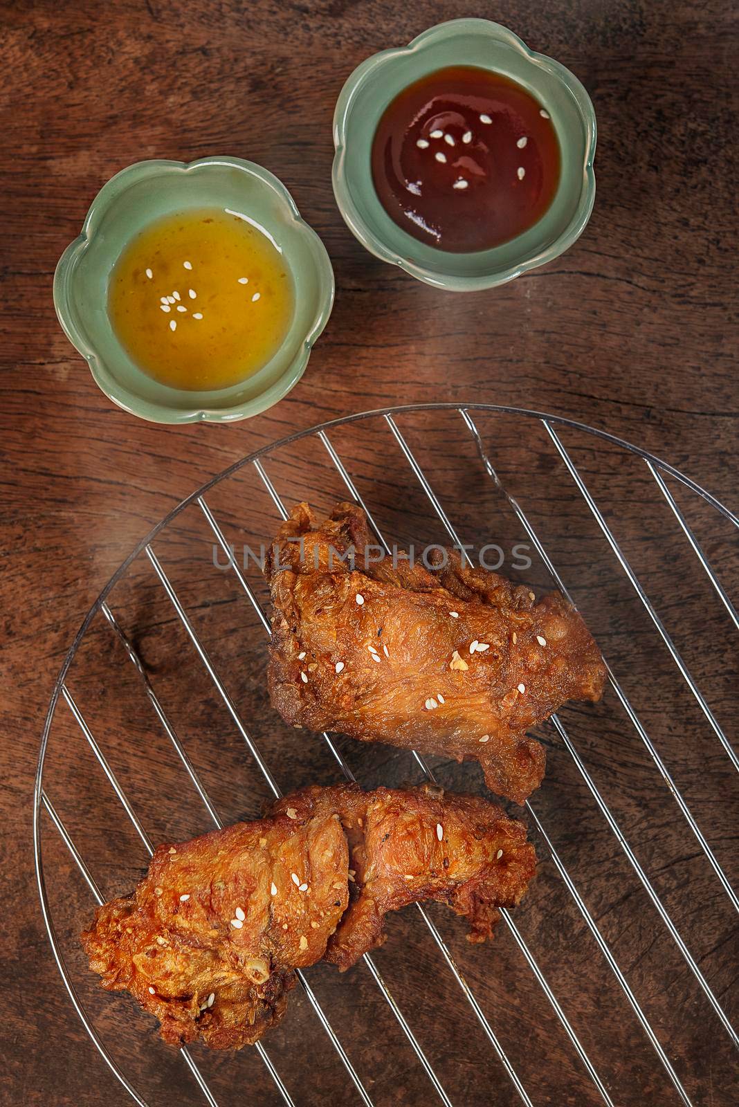 top view deep fried  chicken  served with sweet and tomato sauce