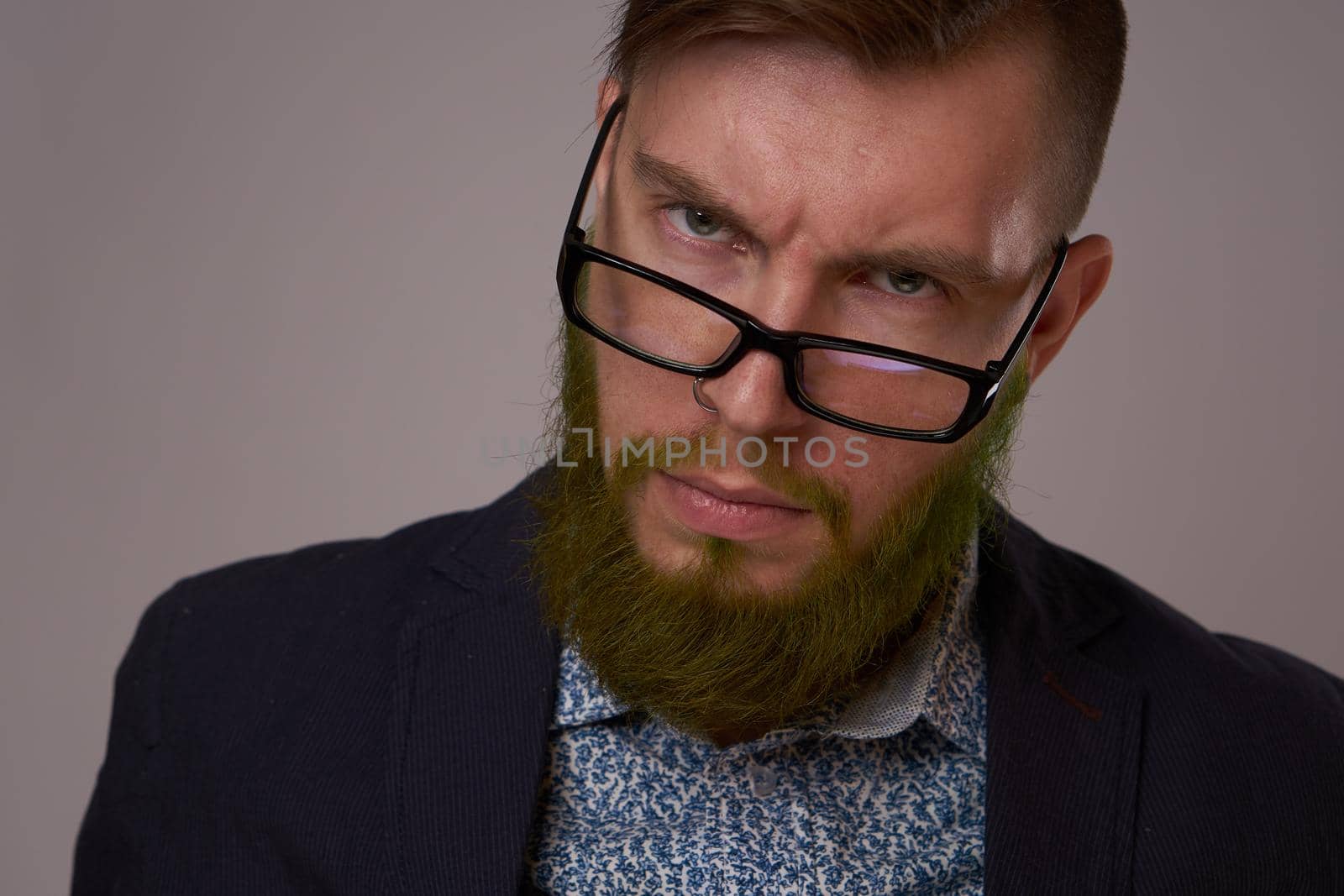 business man with glasses with tattoos on his arms office professionals. High quality photo