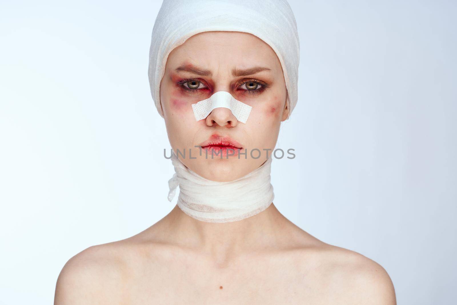 emotional woman cosmetic surgery facial surgery beauty light background. High quality photo