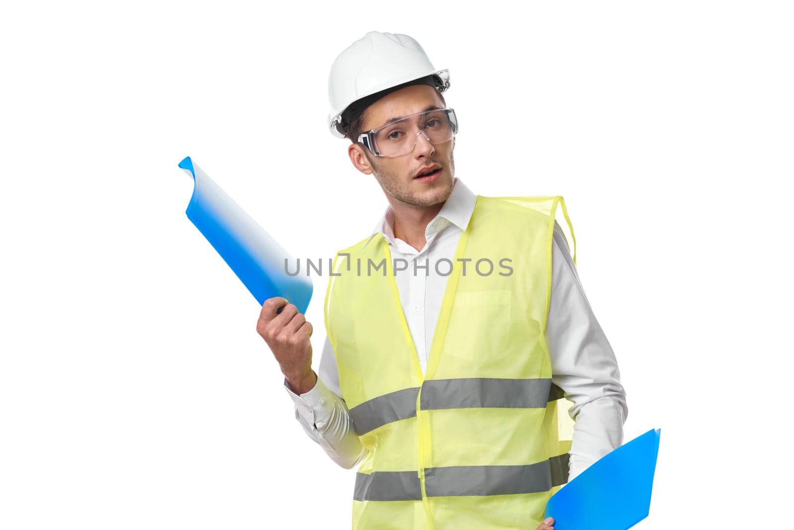 engineer in working uniform protective clothing documents construction by Vichizh