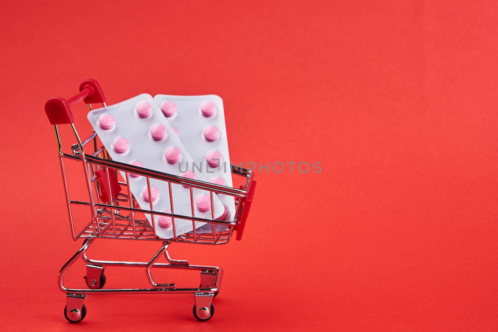 small trolley with medicines pharmacy shop pharmacy pills shopping. High quality photo