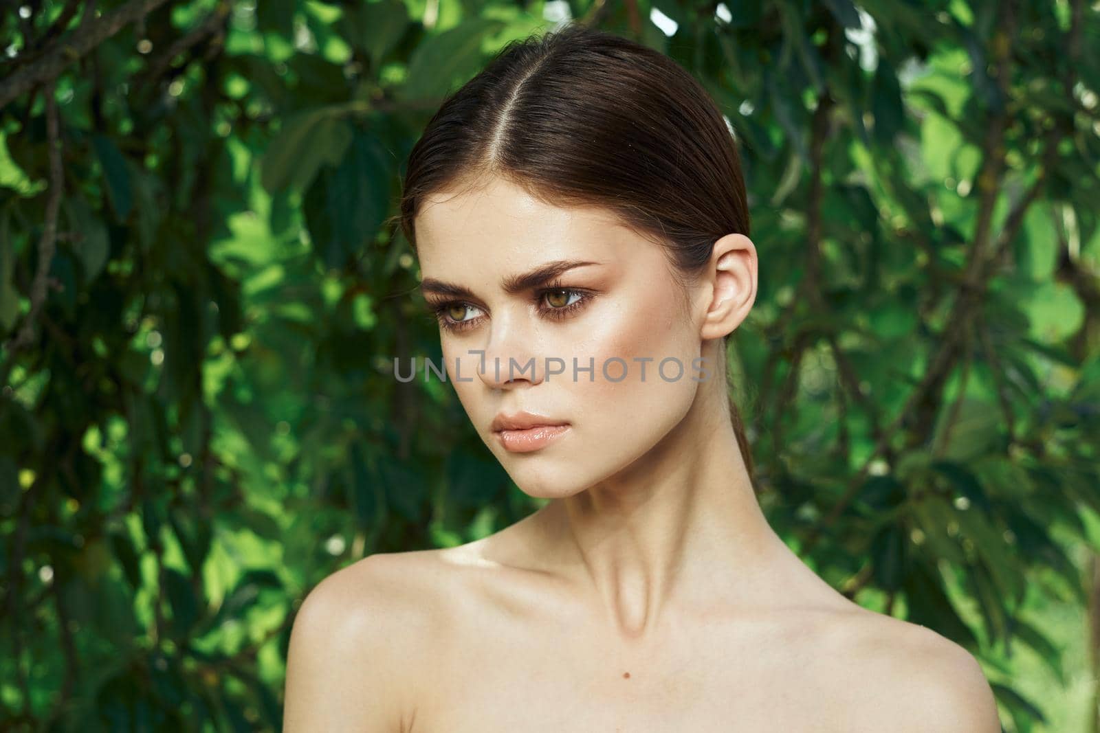 portrait of a woman green leaves clean skin nature summer close-up by Vichizh