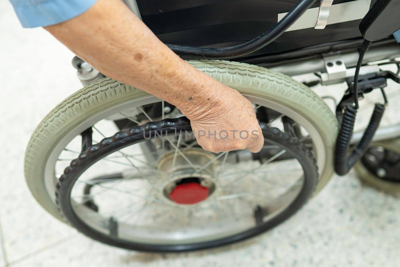 Asian senior or elderly old lady woman patient on electric wheelchair with remote control at nursing hospital ward, healthy strong medical concept by pamai