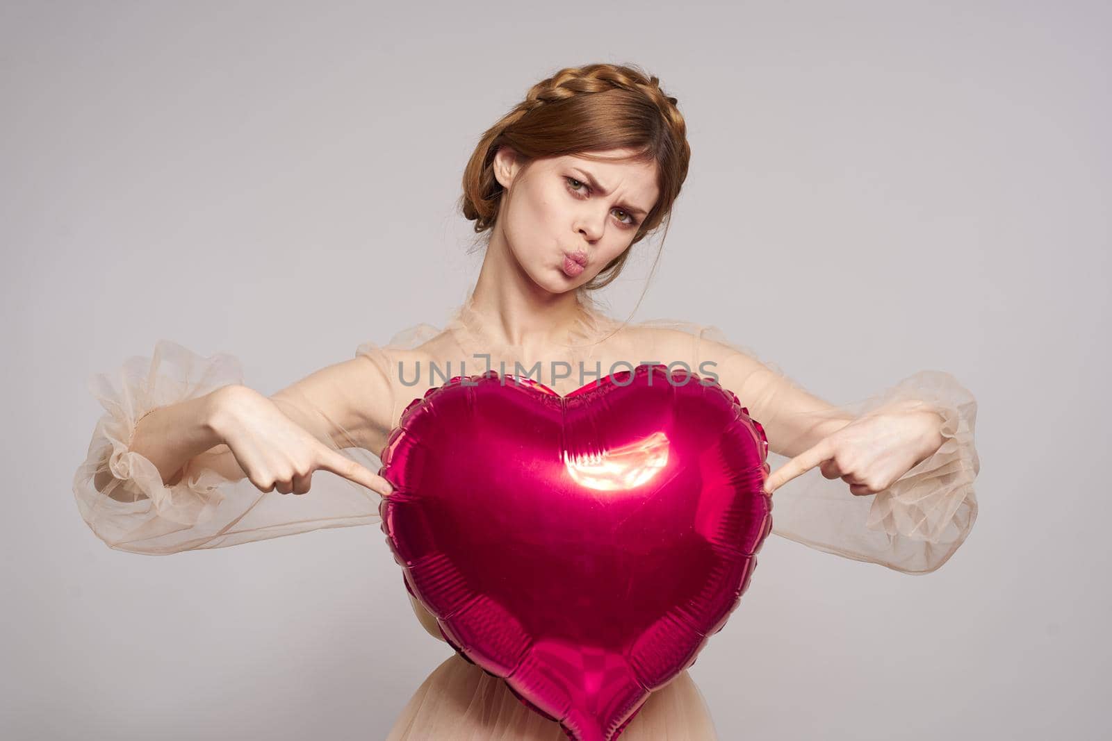 beautiful woman Birthday party gift heart balloon light background. High quality photo