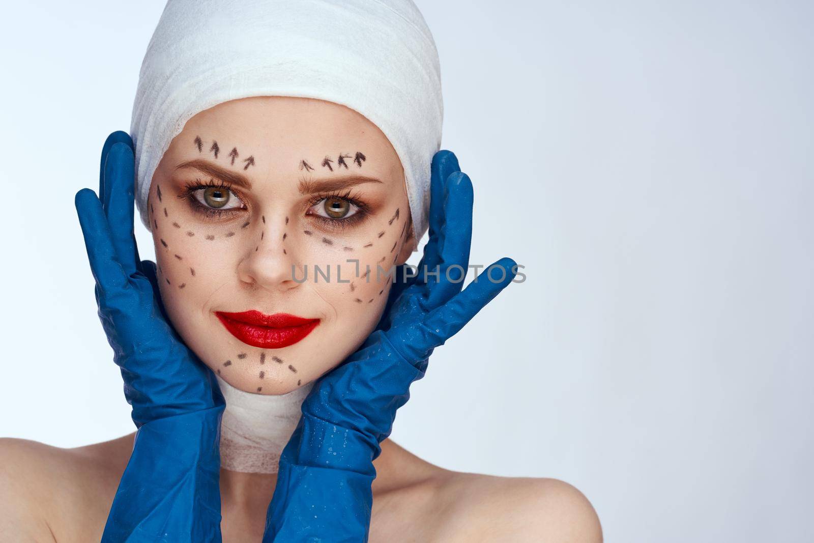 woman Red lips plastic surgery operation bare shoulders light background. High quality photo