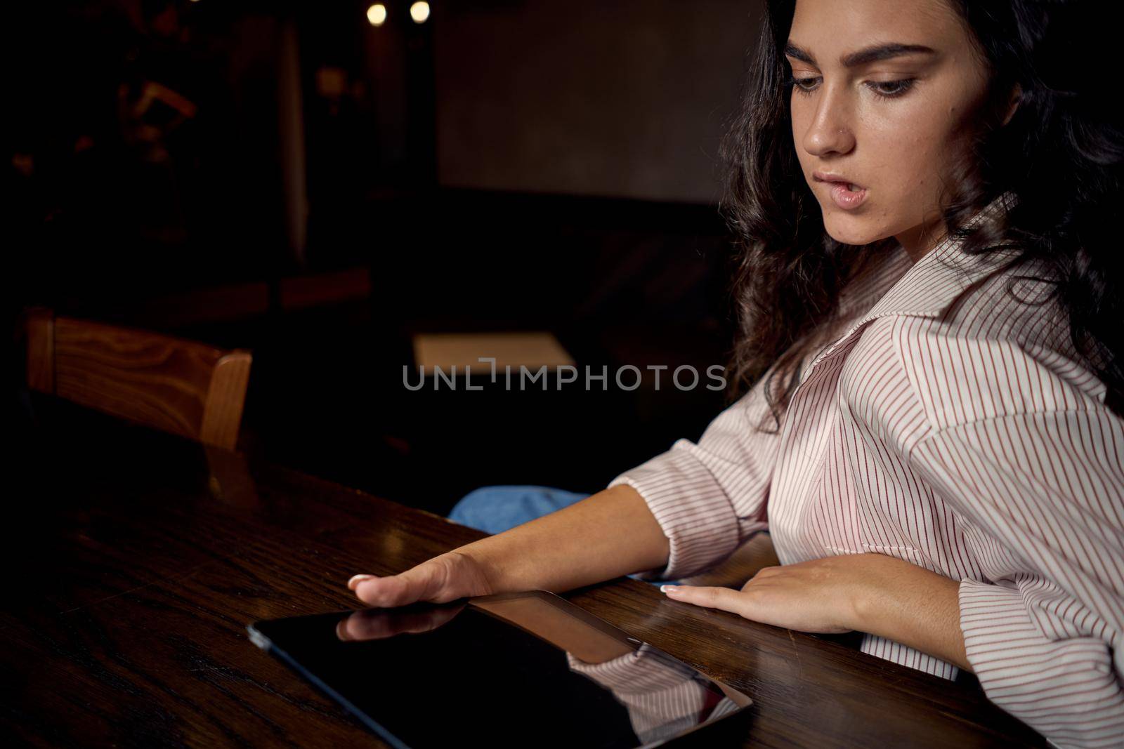 pretty woman in cafe in front of laptop working technology. High quality photo