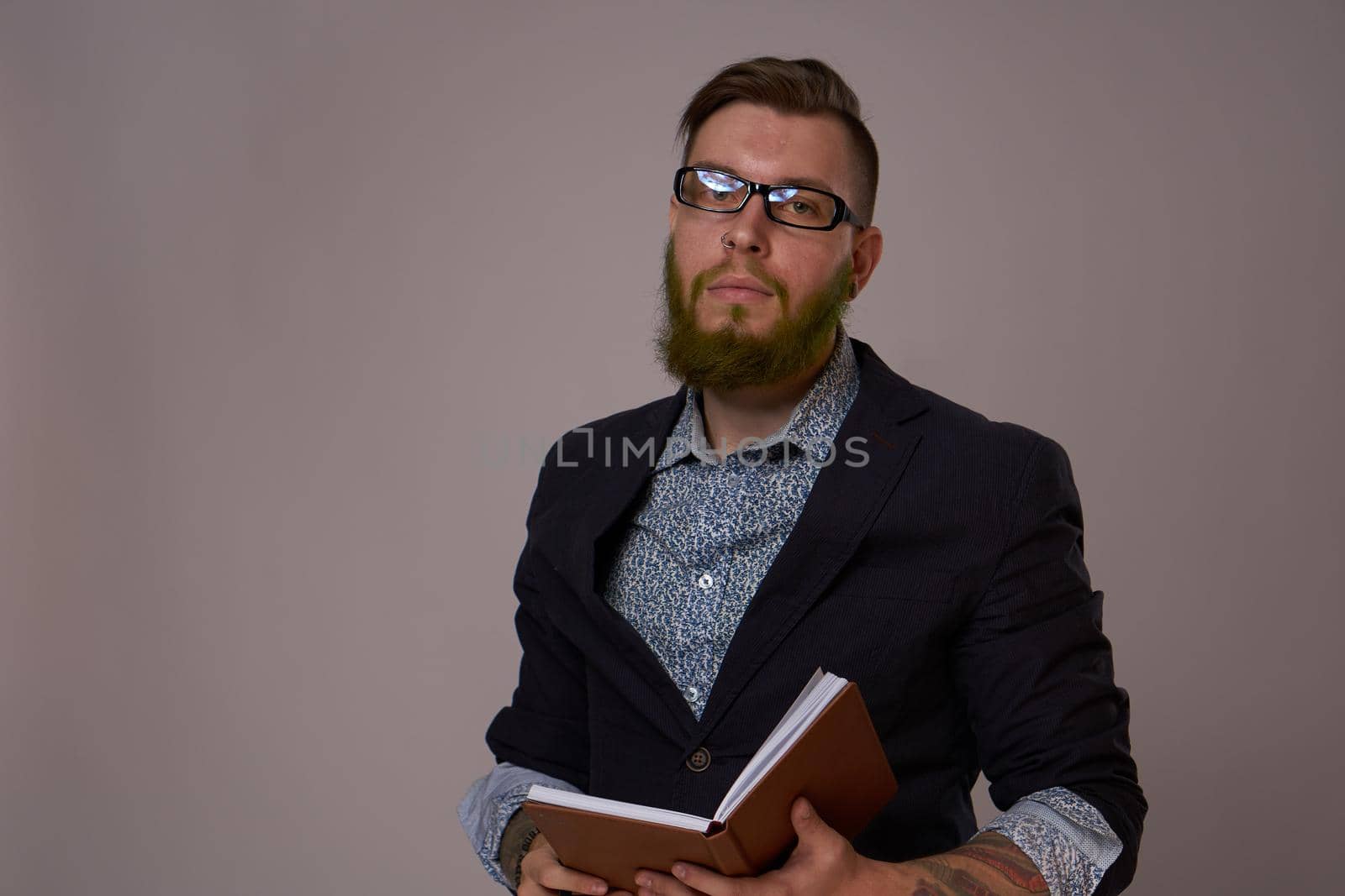 business man with a book in his hands job manager professionals. High quality photo