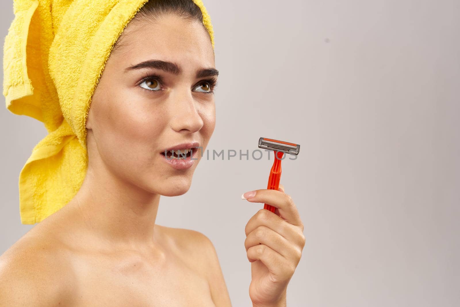 cheerful woman razor in hand skin care hygiene isolated background. High quality photo