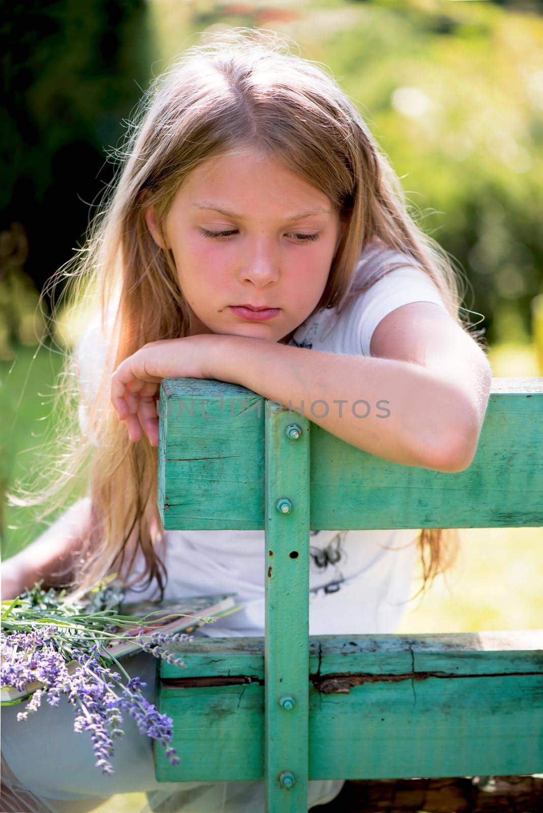 Portrait of little girl with lavender flower bouquet