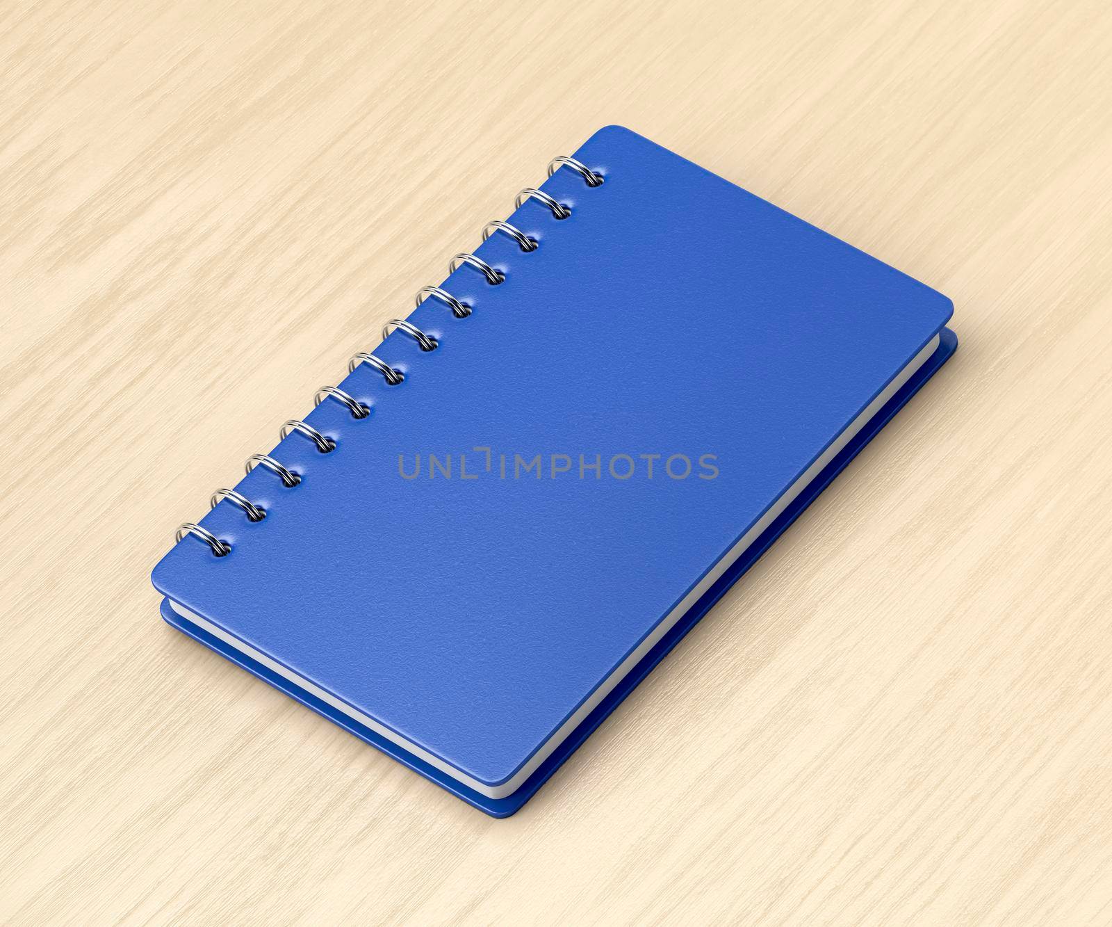 Blue notebook on wooden desk