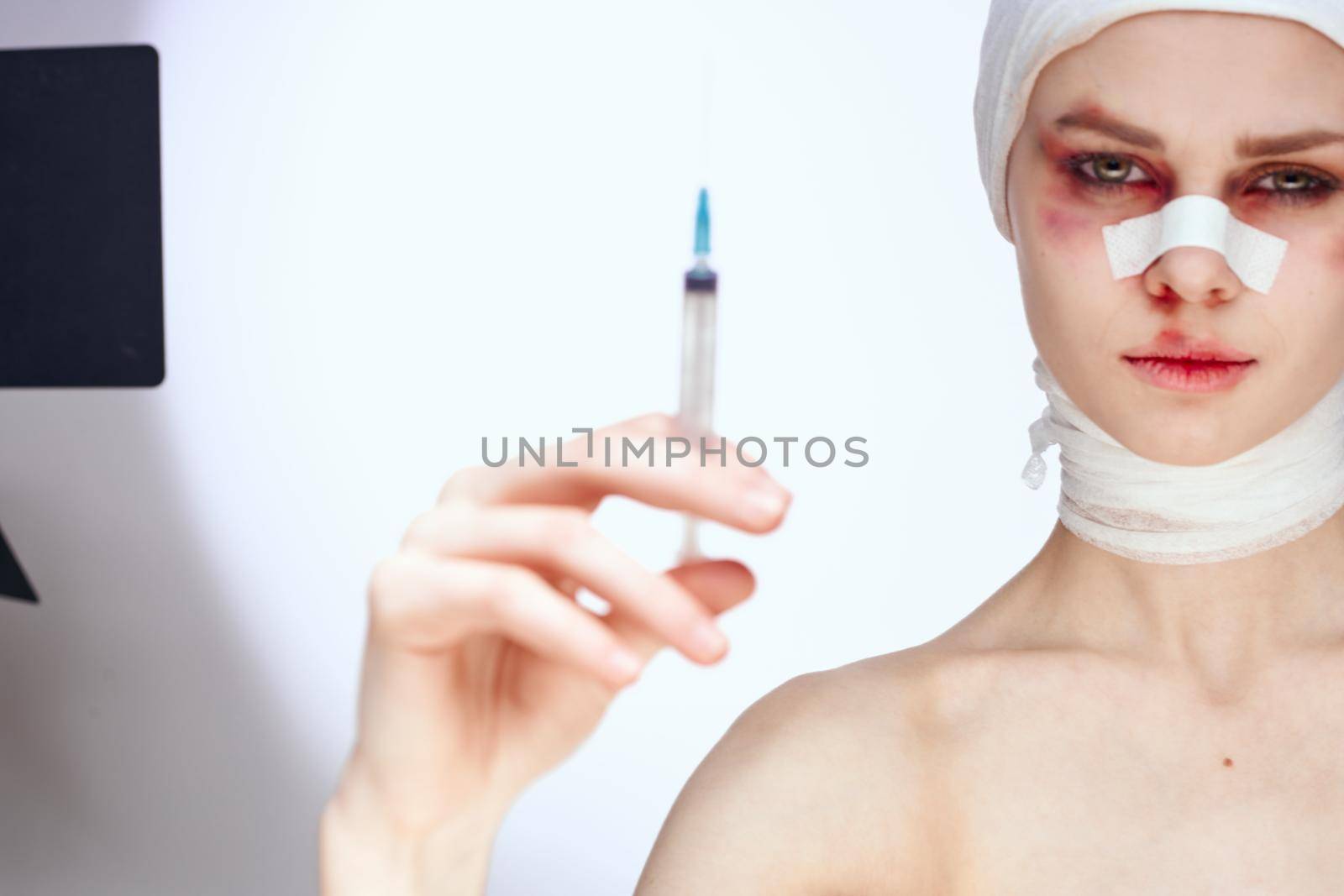 woman plastic surgery operation bare shoulders light background by Vichizh