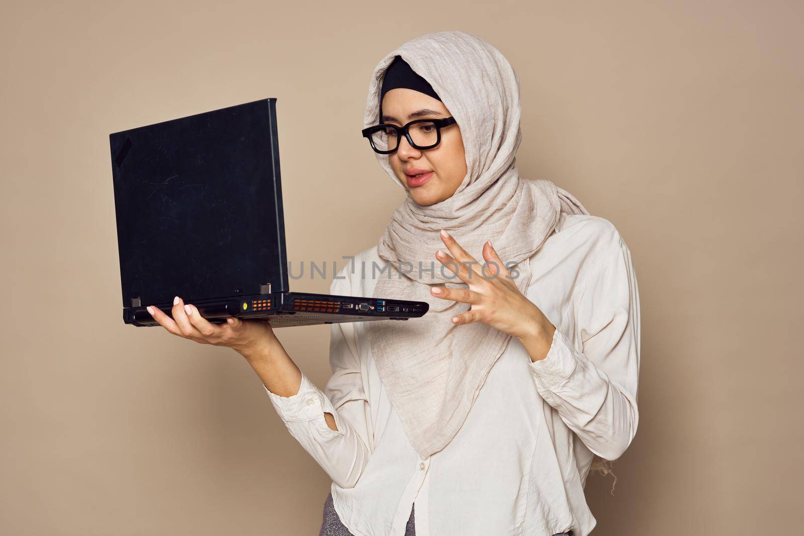 muslim woman with laptop work learning technology by Vichizh