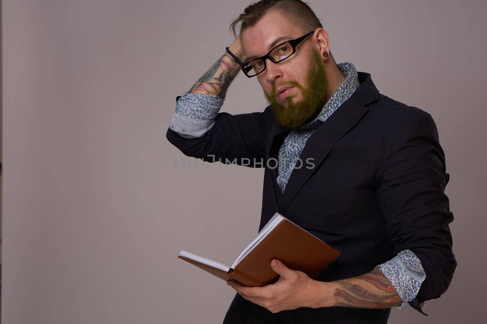 business man with a book in his hands job manager professionals. High quality photo