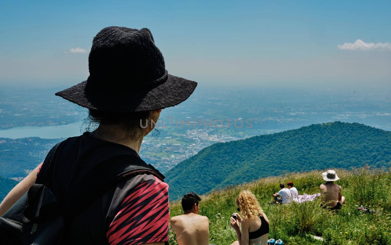 girl or woman looking breathtaking panorama from Palanzone Mountain - como - Lombardy